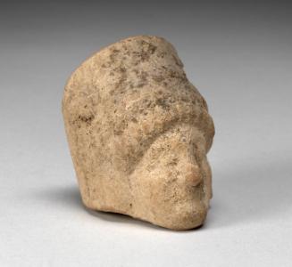 Head of a woman; fragment of terracotta figurine