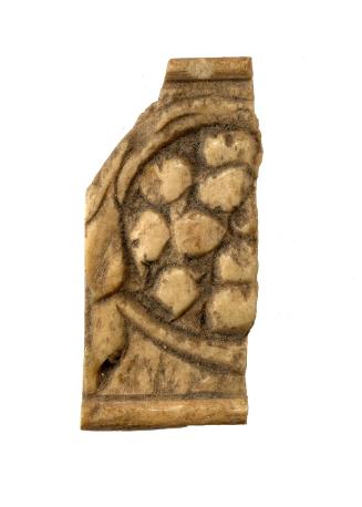 carved bone ornament fragment