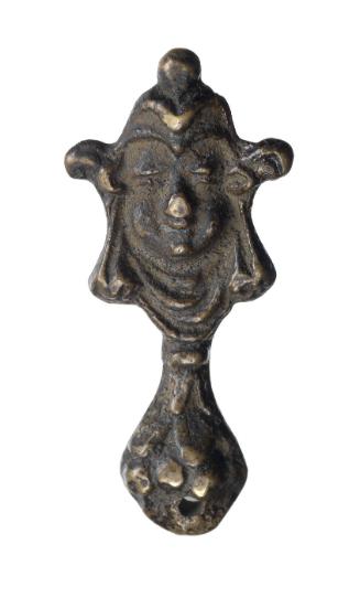 Ornament or jewelry (?) with face