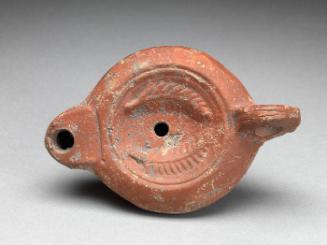 Oil lamp with palm frond motif