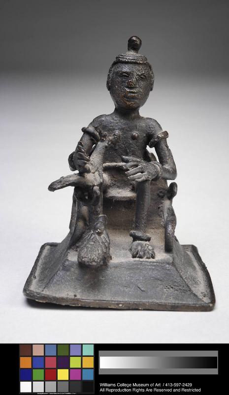 Gold weight in form of a seated man with bird