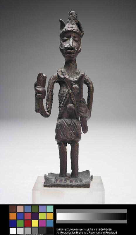Gold weight in form of a standing man holding tools