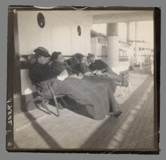 Maurice B Prendergast on deck chair on board ship (far right)