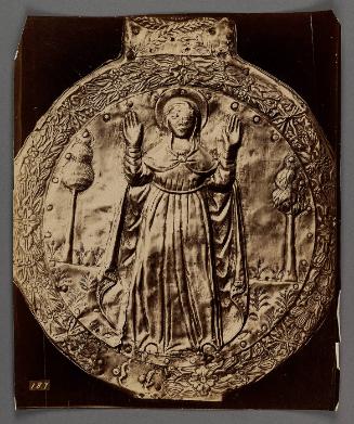 Full length circular carving of female saint