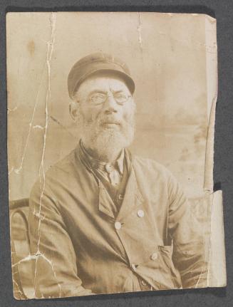 Unknown friends or relatives; bearded man with hat and glasses