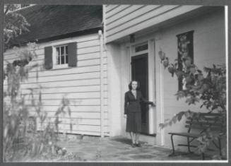 Series including Antoinette Maynard, Charles Prendergast, Eugénie Prendergast, Elizabeth Crawford and Marion Travis; Antoinette Maynard standing outside house