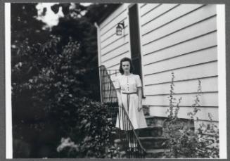 Series including Antoinette Maynard, Charles Prendergast, Eugénie Prendergast, Elizabeth Crawford and Marion Travis; Antoinette Maynard on steps outside house