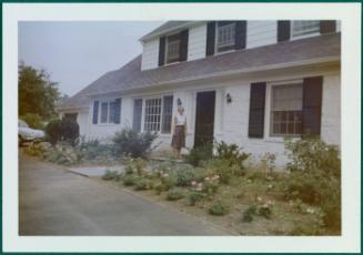 Margaret Connor in front of Compo Road house