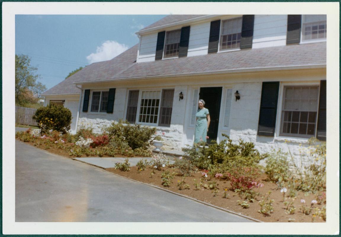 Eugénie Prendergast in front of Compo Road house