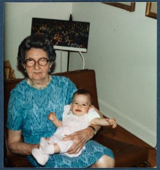 Eugénie Prendergast holding an infant on her lap