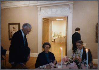 Series of a dinner at Williams College Museum of Art including Eugénie Prendergast and others; Eugénie Prendergast seated at table