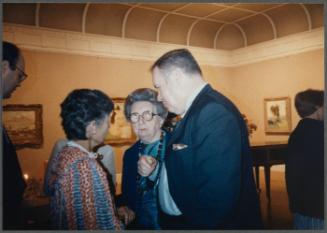 Series of a dinner at Williams College Museum of Art including Eugénie Prendergast and others; (L to R) unknown person, Eugénie Prendergast, Joe Butler