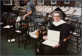 Eugénie Prendergast receiving her honorary degree at 1985 Williams College Commencement ceremony including friends and college officials; Eugénie Prendergast with her degree