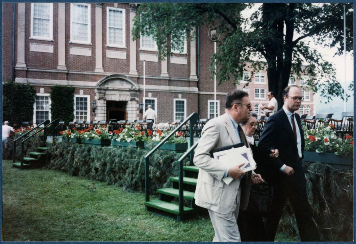 Eugénie Prendergast receiving her honorary degree at 1985 Williams College Commencement ceremony including friends and college officials; (L to R) Joe Butler, Eugénie Prendergast, Tom Krens walking towards stage
