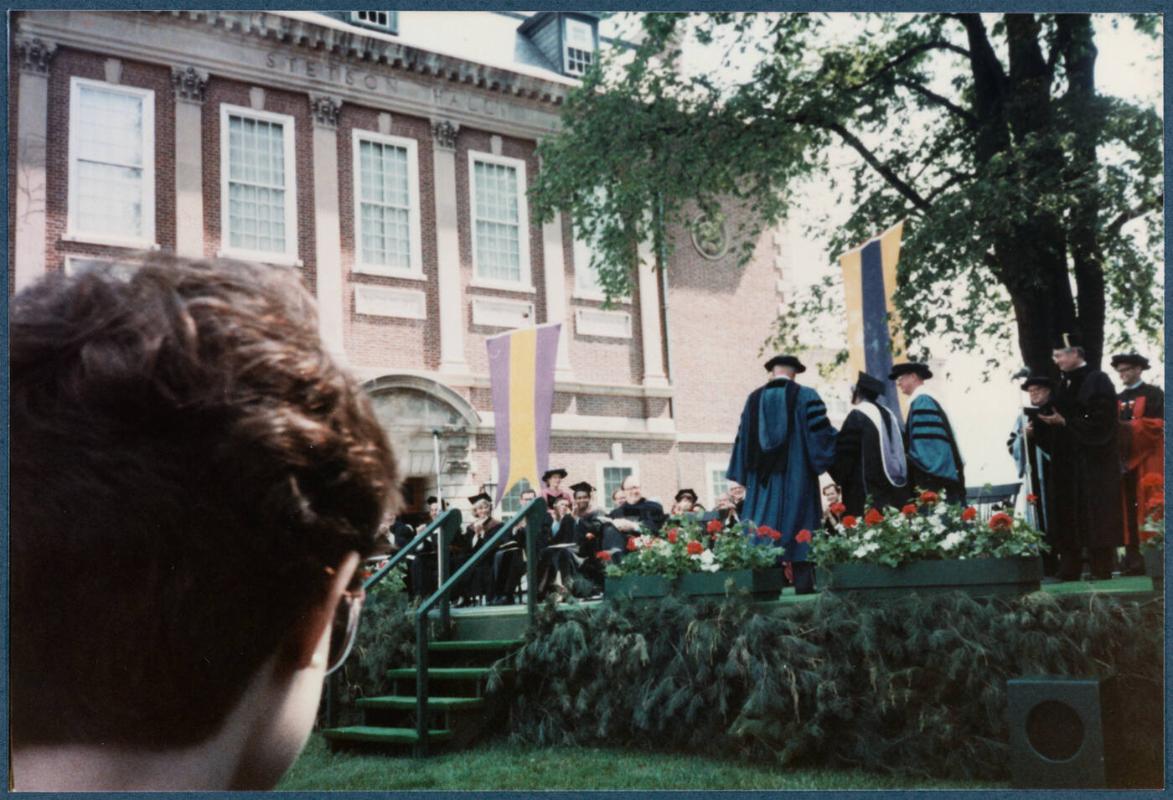 Eugénie Prendergast receiving her honorary degree at 1985 Williams College Commencement ceremony including friends and college officials; Eugénie Prendergast walking with officials to be seated on stage