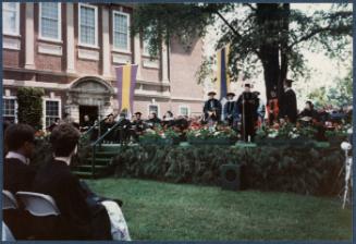 Eugénie Prendergast receiving her honorary degree at 1985 Williams College Commencement ceremony including friends and college officials; Eugénie Prendergast on stage