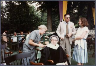 Eugénie Prendergast receiving her honorary degree at 1985 Williams College Commencement ceremony including friends and college officials; (L to R) Cathy Genvert, Eugénie Prendergast, Joe Butler