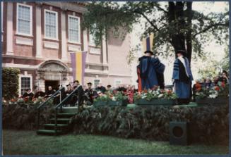 Eugénie Prendergast receiving her honorary degree at 1985 Williams College Commencement ceremony including friends and college officials; commencement scene