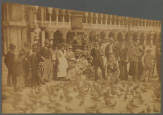 Photograph: Feeding the Pigeons in front of the Ducal Palace