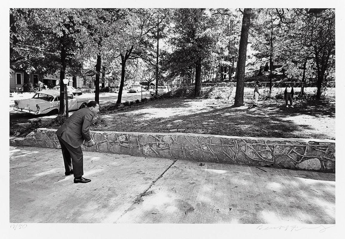 In the front yard of his Atlanta home, Dr. Martin Luther King, Jr. takes time for a game of catch with his sons (from "Countdown to Eternity")