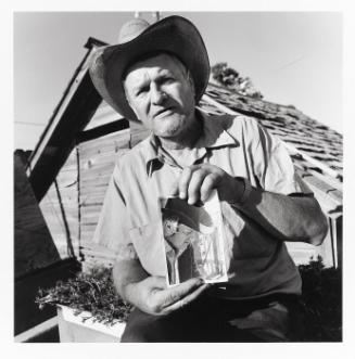 Darius Walter with Photograph of Himself, Lamona colony, Washington (from the "Hutterite" series)