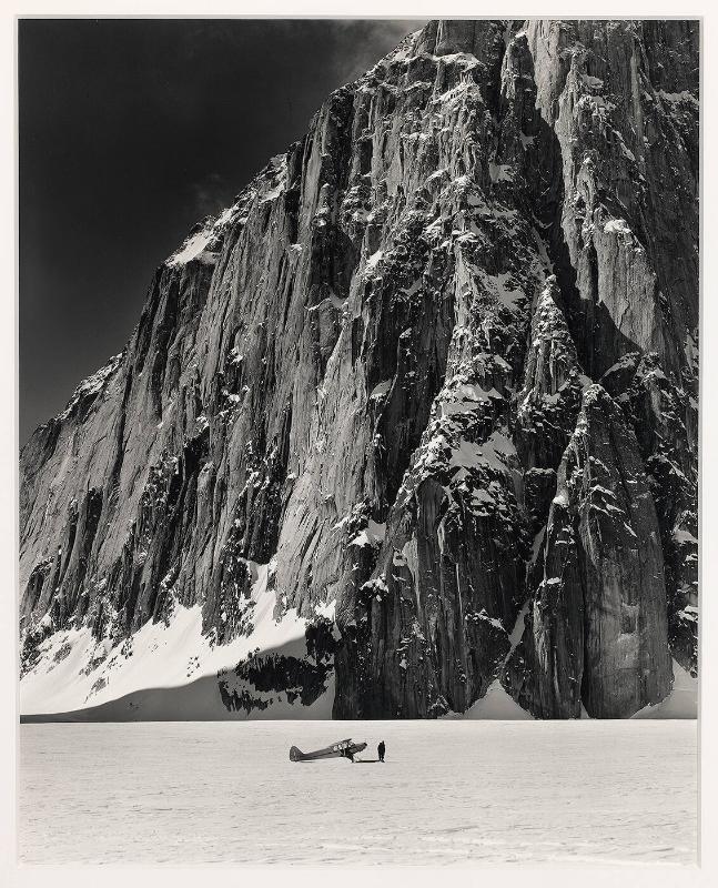 Don Sheldon with his Super Cab Plane in the Great Gorge of the Ruth Glacier at the foot of Mt. Dickey, Alaska, 1955