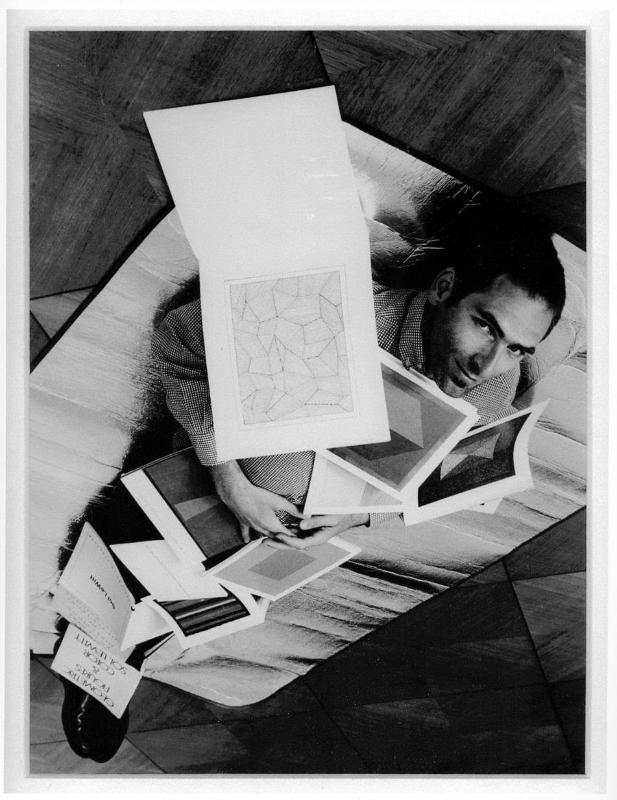 The artist covered in a selection of his Sol LeWitt books (cut) (after Ed Ruscha) Down