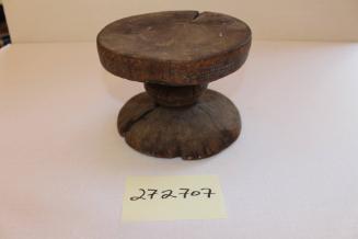 Stool with carved geometric designs