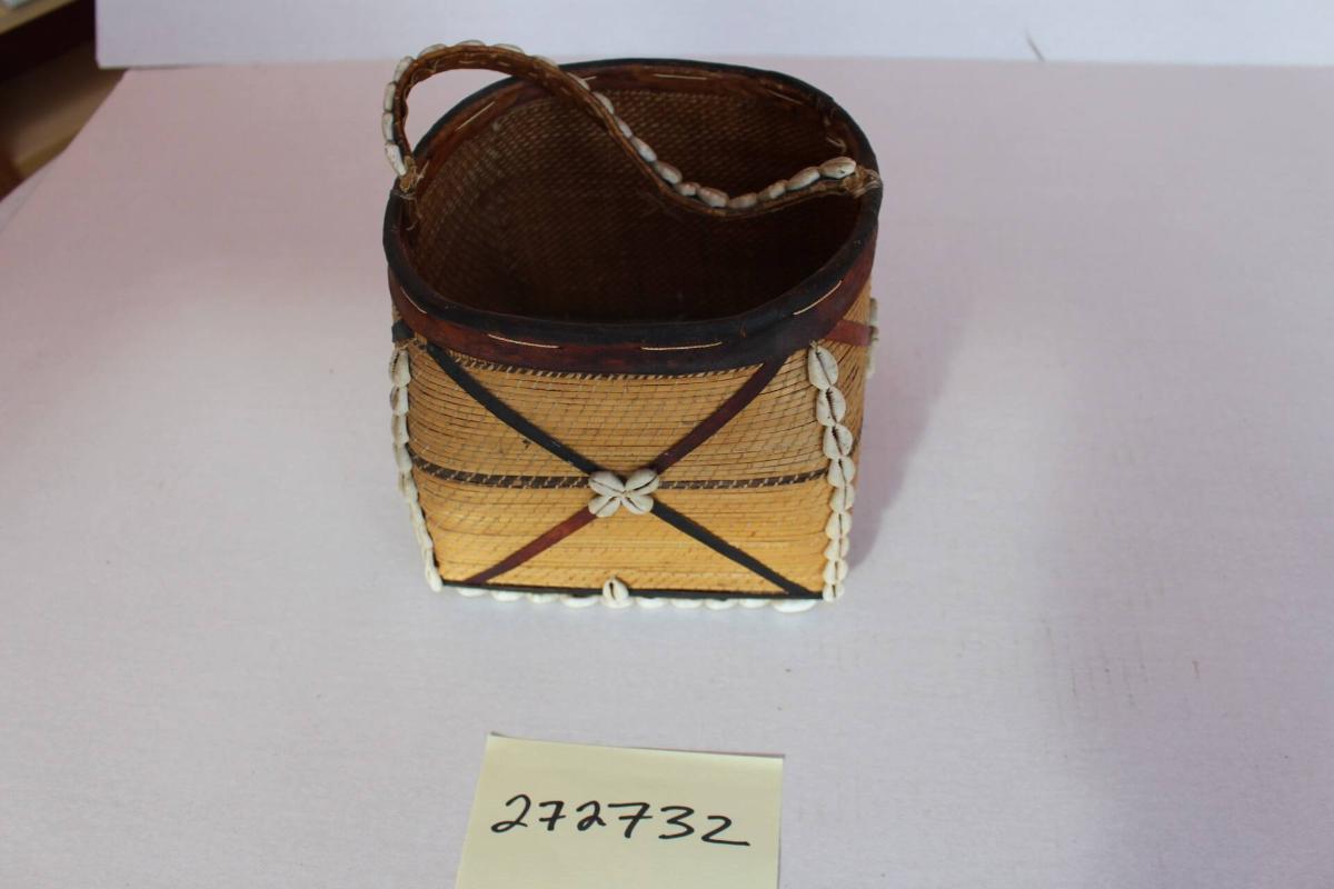 Basket with handle and cowries