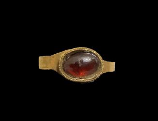 Ring with inset garnet