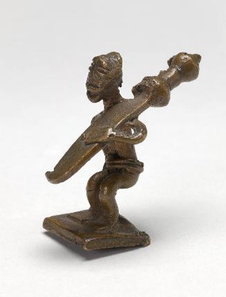 Gold weight in the form of a man carrying a sword