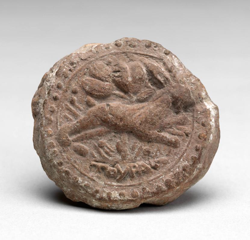 Disk with running tiger relief