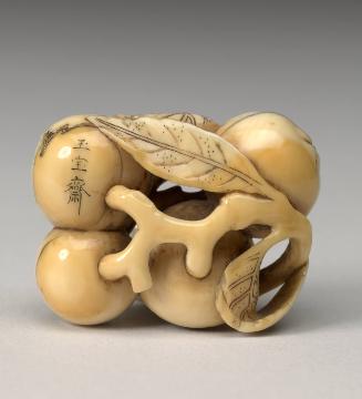 Netsuke depicting berries carved with village scenes