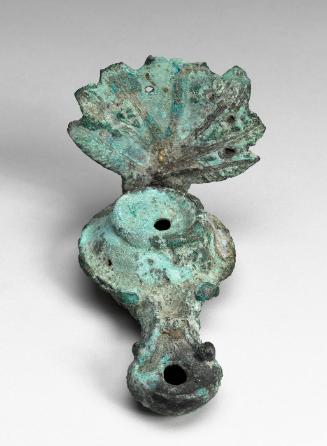 Oil lamp with palm-leaf handle