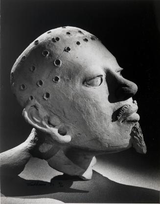 Head with beard (profile)
