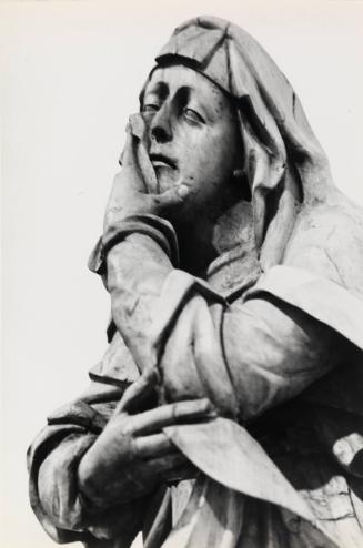 Sculpture of cloaked figure