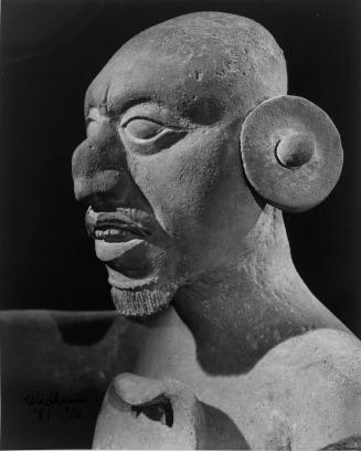 Male head with earring