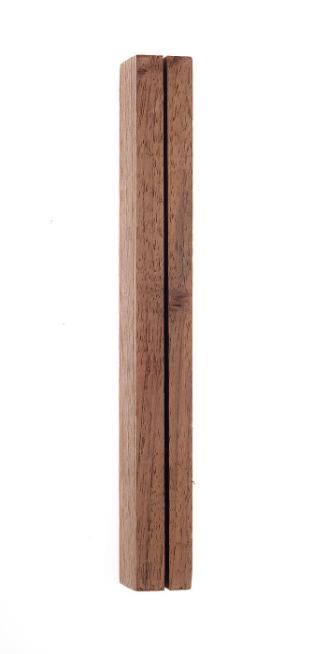 block of wood (possibly handle of unidentified tool)