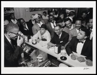 Malcolm X photographing Cassius Clay, Miami