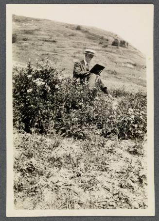 Eugénie and Charles Prendergast 1927 tour of France and Monaco; Charles Prendergast reading outdoors in French Alps