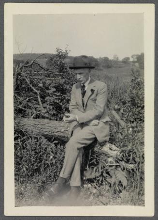 1927-1929 series of Eugénie and Charles Prendergast and Vankemmel family members in France; Charles Prendergast seated outside