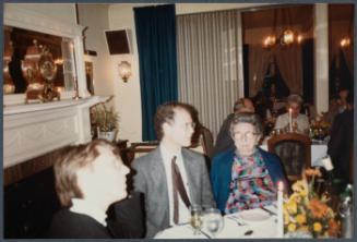 Series of a dinner at Williams College Museum of Art including Eugénie Prendergast and others; Eugénie Prendergast at table