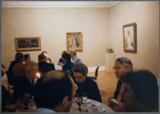 Series of a dinner at Williams College Museum of Art including Eugénie Prendergast and others; Eugénie Prendergast at table