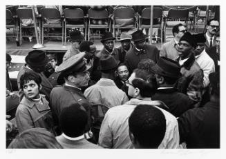 Surrounded by supporters and security personnel, Dr. Martin Luther King, Jr. prepares for his speech at the United Nations, April 15, 1967 (from "Countdown to Eternity")