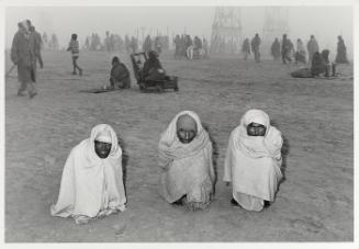Three Pilgrims at the Sangam, Kumbh Mela, Allahabad, India
