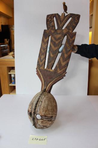 Mask with small bird atop