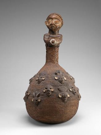 Coal basket with figural stopper