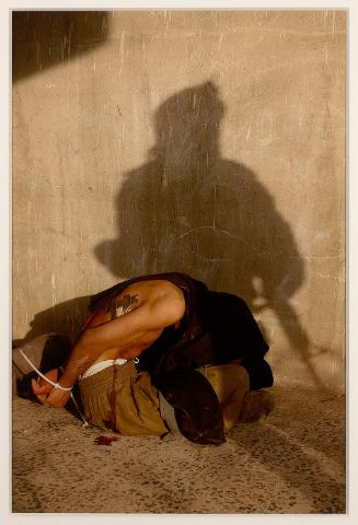 One of four Iraqis who surrendered to the marines and said they were students trying to avoid battle, from "The New York Times, Sunday, November 14, 2004"
