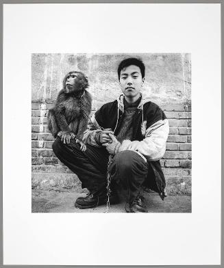 A Boy and His Monkey (from "The Chinese")