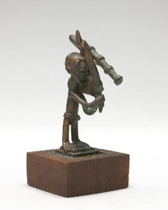 Gold weight in the form of a farmer with a sword